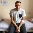 Russian opposition leader Alexei Navalny sitting on a hospital bed in Moscow