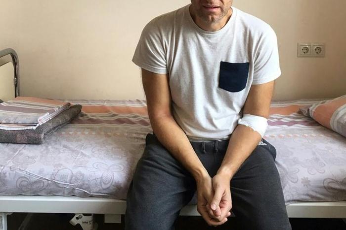 Russian opposition leader Alexei Navalny sitting on a hospital bed in Moscow