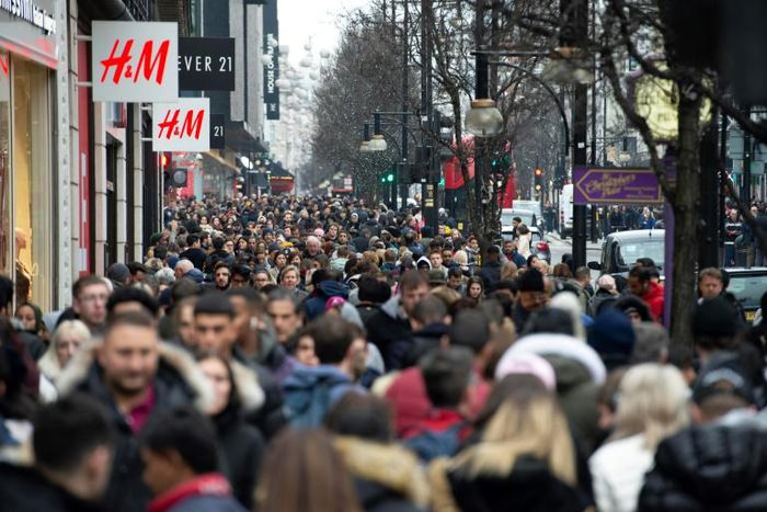 Scenes like this image of London shoppers taken on December 27, 2018 could become more common in countries where the population is booming - although overall global growth is slowing