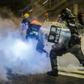 Police charge protesters in the shopping district of Causeway Bay in Hong Kong