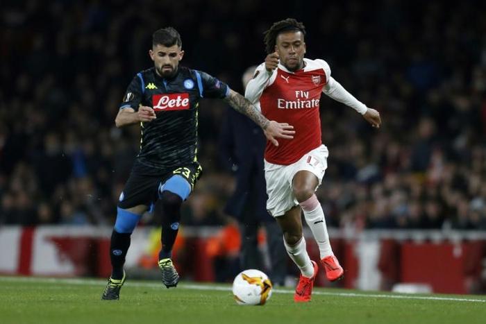Nigerian Alex Iwobi (R) playing for Arsenal against Napoli in a 2018/2019 Europa League quarter-final