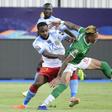 Madagascar midfielder Anicet Andrianantenaina (R) tussles for possession with Democratic Republic of Congo forward Cedric Bakambu during an Africa Cup of Nations last-16 match in Egypt