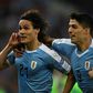 Uruguay's Edinson Cavani (L) celebrates with teammate Luis Suarez after scoring in a 1-0 Copa America win over Chile