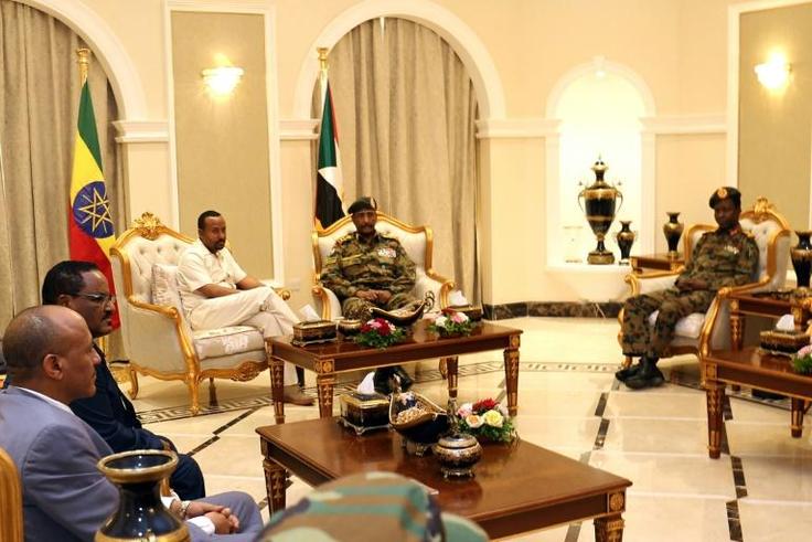 Ethiopia's Prime Minister Abiy Ahmed (C-L) met met separately with Sudan's ruling generals and protest leaders to try and revive talks between the two sides after a bloody crackdown on demonstrators that left dozens dead