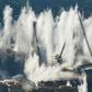 The remains of the 4,500-tonne bridge collapsed in seconds as officials and locals watched the demolition from a distance