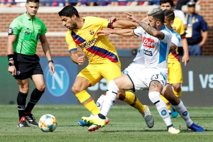 Luis Suarez, center, scored two goals to help spark Barcelona over Napoli 4-0 on Saturday at Ann Arbor, Michigan