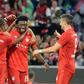 Canadian international Alphonso Davies (C) is hoping to break into the Bayern Munich first team this season