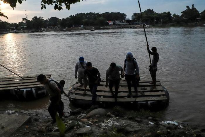 Central American migrants use a makeshift raft to illegally cross the Suchiate river from Tecun Uman, in Guatemala, to Ciudad Hidalgo, Mexico -- the US is trying to stem the flow of migrants towards the US border