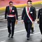 Peru's late defense minister Jose Huerta (L), seen walking next to President Martin Vizcarra (C) at a celebratory parade in Lima in July 2018, died of a heart attack suffered during a visit to troops
