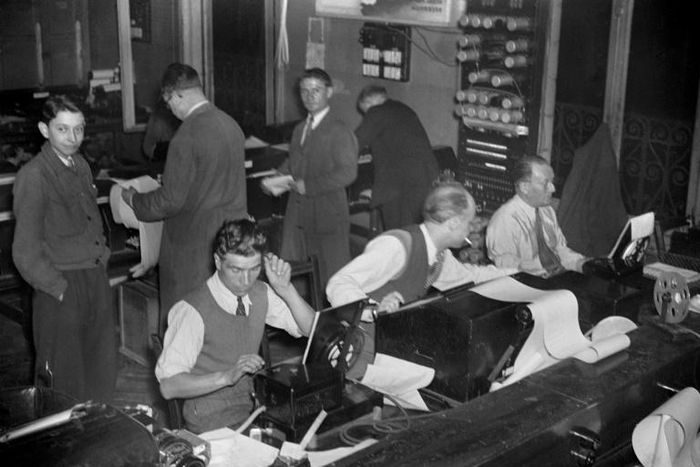 Journalists at work at AFP in 1946, two years after it was reclaimed from the pro-Nazi regime during the uprising that liberated Paris from German occupation