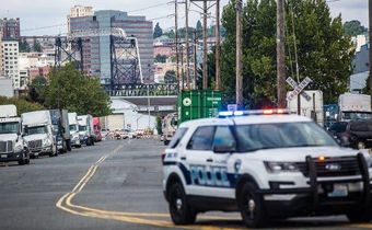 Man attacking ice detention center is fatally shot by the police