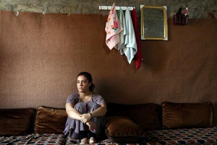 Yazidi teenager Jihan Qassem faced an impossible choice after being freed from years as a hostage of the Islamic State group, abandon her three young children fathered by a jihadist fighter or risk being ostracised by her community