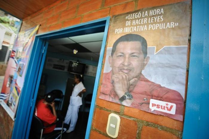 A poster with the face of the late Venezuelan president Hugo Chavez on the facade of a clinic in Caracas where a Cuban doctor works in 2010