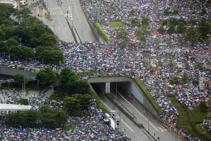 Tens of thousands attended a rally to support Hong Kong's leadership amid the city's biggest political crisis in decades