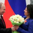 Britain has said it will bar Sputnik news and RT from a global conference on media freedom in London; in this image from May 23 2019, Russia's President Vladimir Putin presents flowers to editor-in-chief of Russian broadcaster RT Margarita Simonyan aft...