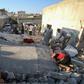 Syrian civilians search for survivors under the rubble of a building following a reported airstrike by Syrian regime forces in Maar Shurin on the outskirts of Maaret al-Numan in northwest Syria's Idlib province