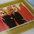 A shop in Pyongyang displays a commemorative stamp featuring North Korean leader Kim Jong Un meeting with Chinese President Xi Jinping ahead of their summit