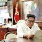 This undated and unlocated picture released from North Korea's official Korean Central News Agency (KCNA)on June 23, 2019 shows North Korean leader Kim Jong Un reading a personal letter from President of the United States of America Donald Trump.