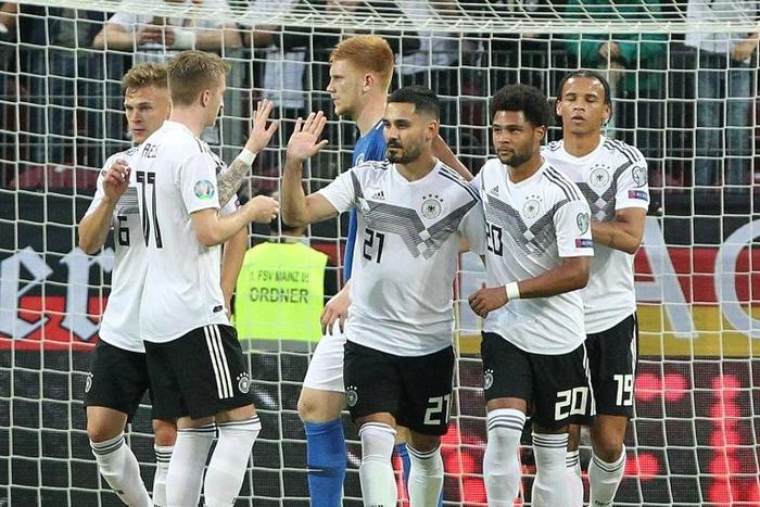 Ilkay Gundogan scored a penalty and created two other goals in Germany's 8-0 thrashing of Estonia on Tuesday