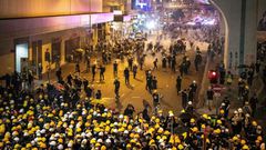 Tear gas filled Hong Kong's commercial district on Sunday