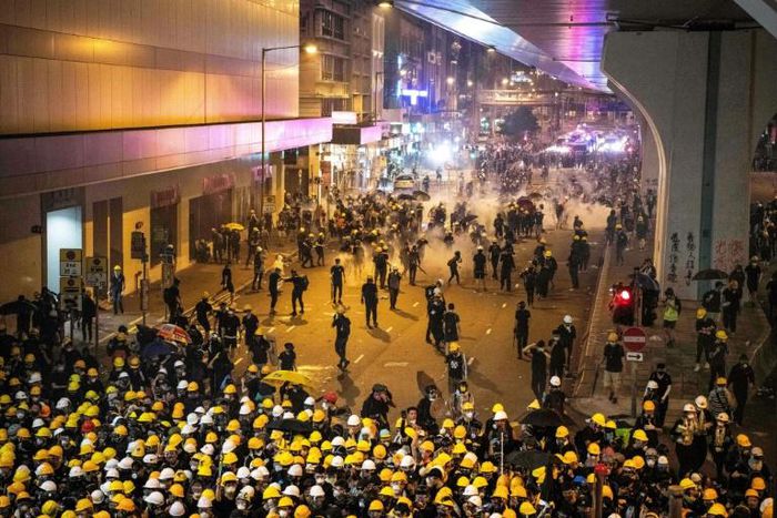 Tear gas filled Hong Kong's commercial district on Sunday