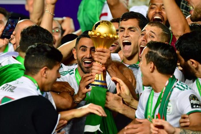 Algeria captain Riyad Mahrez (C) and team-mates celebrate winning the Africa Cup of Nations in Cairo this month