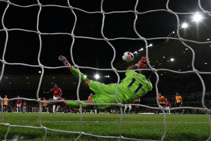 Wolves keeper Rui Patricio saves a penalty from Manchester United's Paul Pogba
