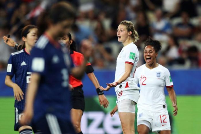 England forward Ellen White celebrates with number 12 Demi Stokes after scoring her second goal in the 2-0 win over Japan