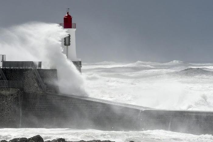 Storm Miguel whipped up huge seas along France's western coast, where three rescuers died when their boat capsized as they tried to help a fishing boat in distress