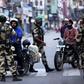 India has imposed a security clampdown on Kashmir and is rushing a bill through parliament to scrap the region's special status