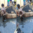 Residents beat up 'thief', gave him food and drinks before supervising him to clean their choked gutters (photos)