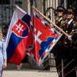 Caputova, reviewing the guard of honour during her inauguration ceremony, compaigned under the slogan "Stand up to evil" yet the community activist had previously been largely unknown