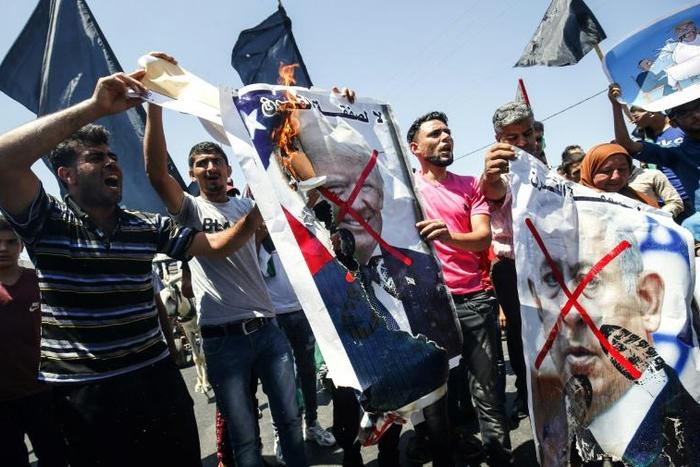 Palestinians demonstrate in the Gaza Strip against the US-sponsored Middle East economic conference
