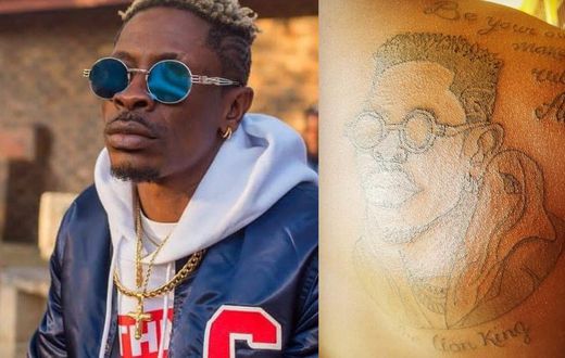 SM Fan tattoos Shatta Wale's face at his back