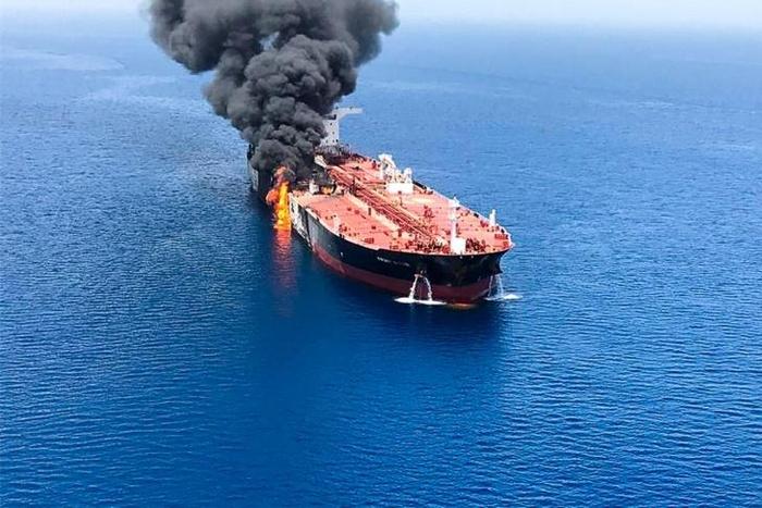 A picture obtained by AFP from Iranian News Agency ISNA shows fire and smoke billowing from Norwegian-owned Front Altair tanker said to have been attacked in the waters of the Gulf of Oman