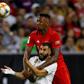 Real Madrid forward Karim Benzema (L) and Bayern Munich defender Jerome Boateng fight for the ball during Bayern's 3-1 friendly victory in Houston, Texas