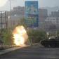 Yemeni fighters loyal to exiled President Abedrabbo Mansour Hadi fire from a tank during clashes with Shiite Huthi rebels in the country's third-city of Taez