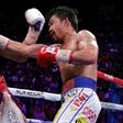 Filipino boxer Manny Pacquiao slams a right to the face of American Keith Thurman