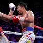Filipino boxer Manny Pacquiao slams a right to the face of American Keith Thurman