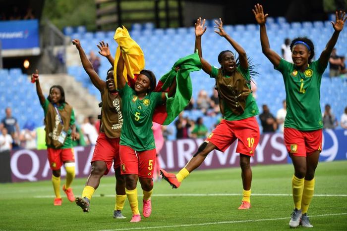 Cameroon players celebrate after Ajara Nchout's last-gasp goal saw them beat New Zealand to qualify for the last 16 of the women's World Cup on Thursday