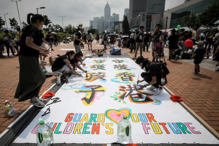 Hundreds of parents and children gathered for an all-ages family protest