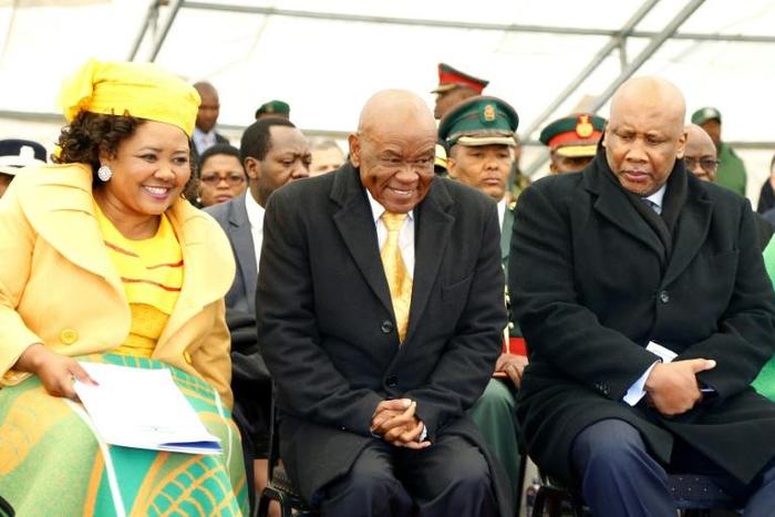 Lesotho Premier Thomas Thabane (C), pictured here with the country's King Letsie III (R), is facing criticism over the role of his wife Maesaiah (L)