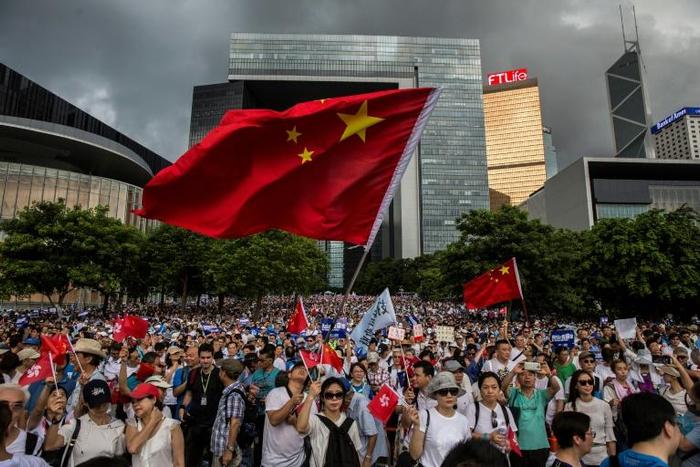 Sunday's rally was comprised of a noticeably older demographic, some waving Chinese flags