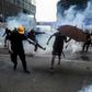 Saturday's clashes saw police baton-charge protesters and fire tear gas