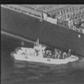The US military on Thursday released grainy footage it said showed an Iranian patrol boat removing a limpet mine from the Kokuka Courageous