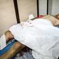 A handout picture released by the official Syrian Arab News Agency (SANA) on July 14, 2019, shows a wounded civilian lying on a hospital bed following a rocket attack in the government-held northern city of Aleppo. Rockets fired by jihadists today kill...