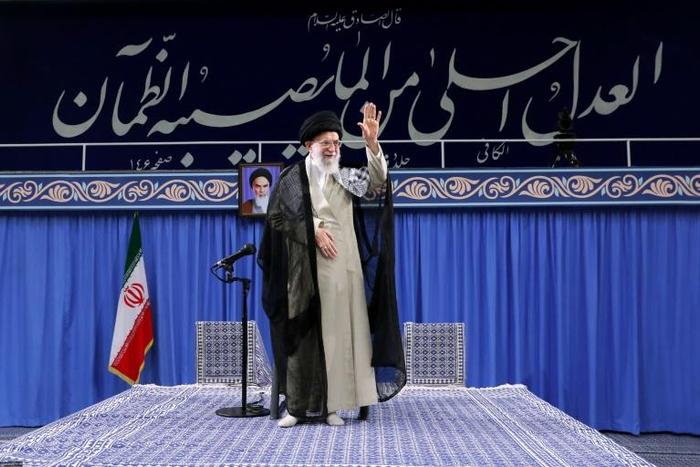 Iran's supreme leader Ayatollah Ali Khamenei waves to the crowd during a gathering in Tehran