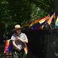 A park ranger places rainbow flags at the Stonewall National Monument, the first LGBTQ national monument, dedicated to the birthplace of modern lesbian, gay, bisexual, transgender, and queer civil rights movement on June 4, 2019 in New York City