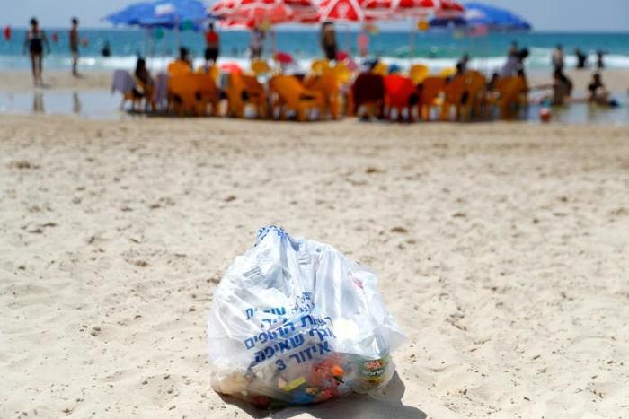 Environmental groups are trying to clean up the plastic on Israel's beaches but face a battle to break habits