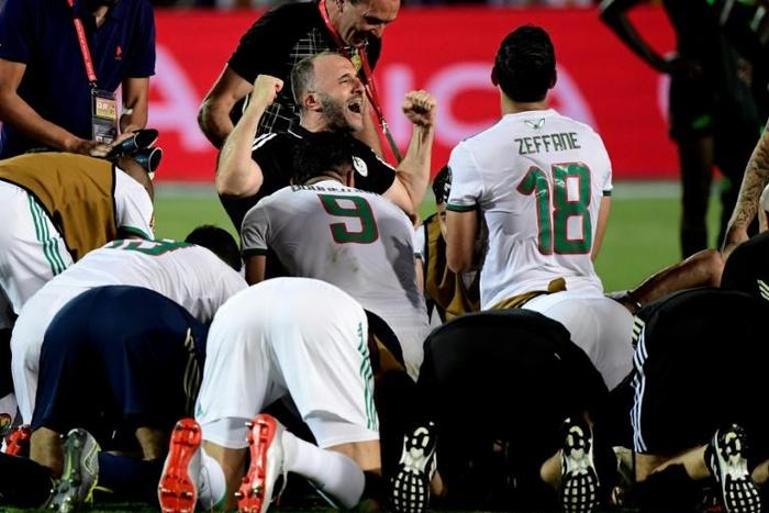 Algeria coach Djamel Belmadi (C) celebrates a win that put his team through to the Africa Cup of Nations final
